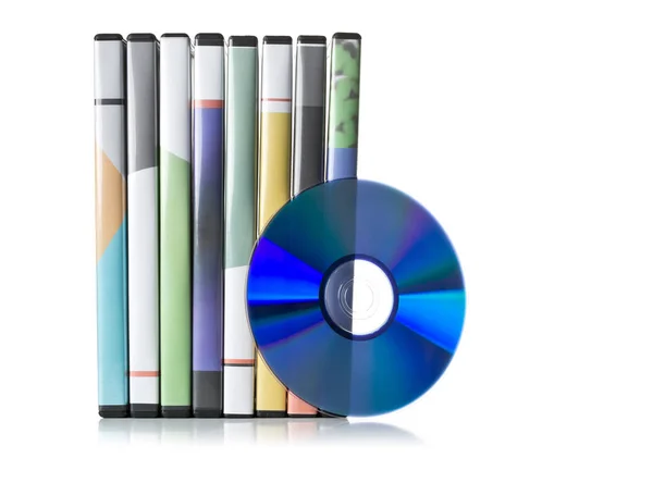 DVD, CD-ROM or Blu-Ray disc with stacked boxes for movies, audio — Stock Photo, Image