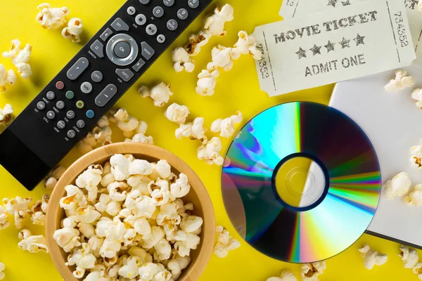 DVD or blu ray movie disc with tv remote control, movie tickets — Stock Photo, Image