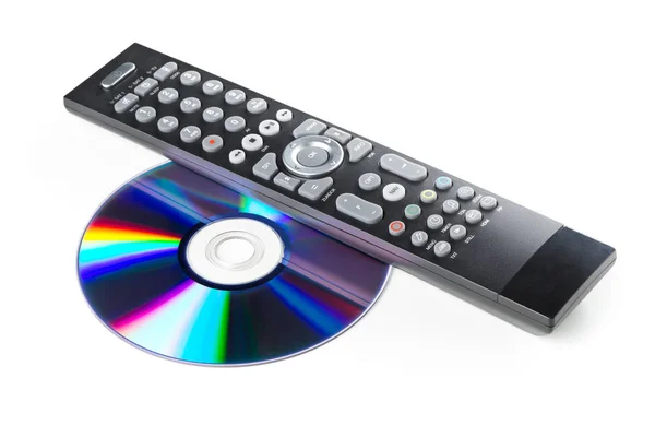 DVD, CD-ROM or Blu-Ray disc with tv or disc player remote contro — Stock Photo, Image