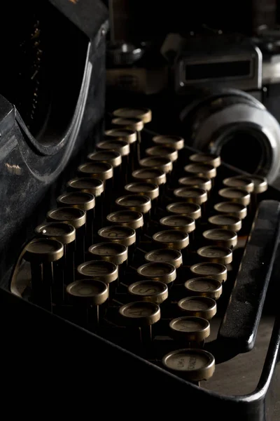 Vintage retro typewriter keys close up and analog film camera — Stock Photo, Image