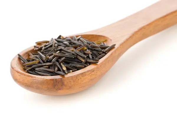 Heap Uncooked Raw Black Wild Rice Grains Wooden Spoon White — Stock Photo, Image