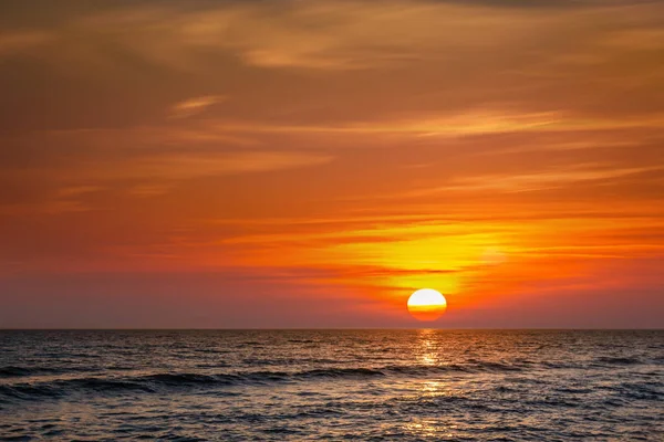Sun at sunset on a mediterranean sea — Stock Photo, Image