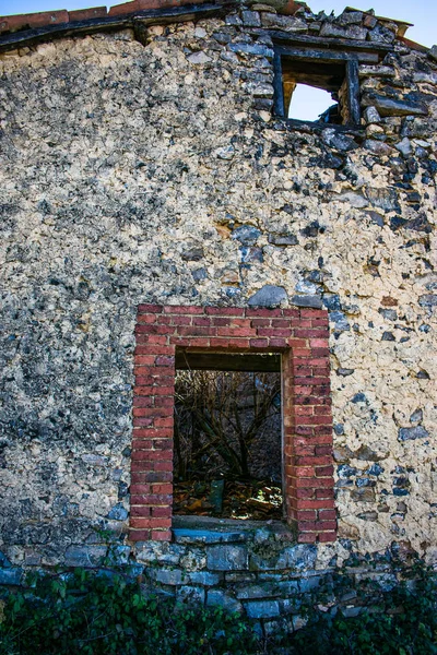 windows of abandoned old house in ruins in spain