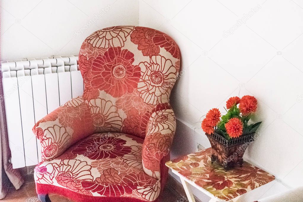antique armchair with floral pattern