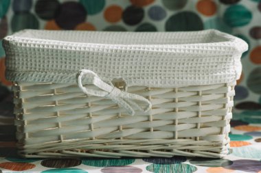 empty white wicker basket with white cloth interior clipart