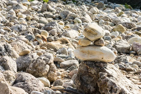 texture of stacked rocks on the beach in gray colors