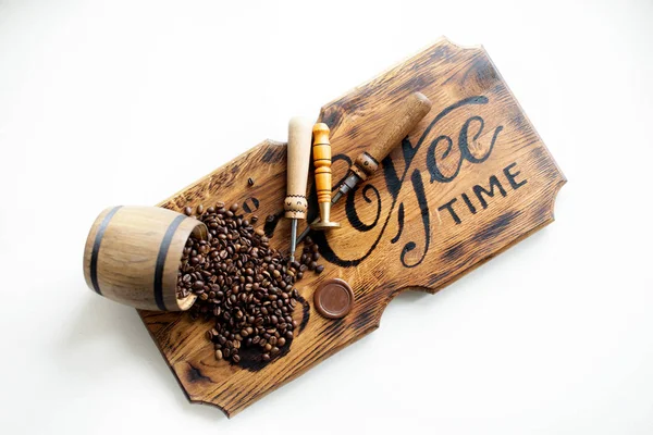 Tools for repairing coffee machines close-up. Coffee beans, wooden board, coffee machine, kitchen table, Espresso coffee cup