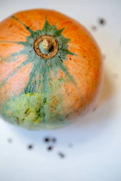 large pumpkin on white table, top view
