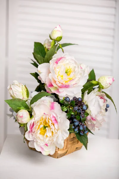 Bouquet of beautiful mixed flowers in vase. Lovely bunch of flowers. Work of the professional florist. Wedding or home decor