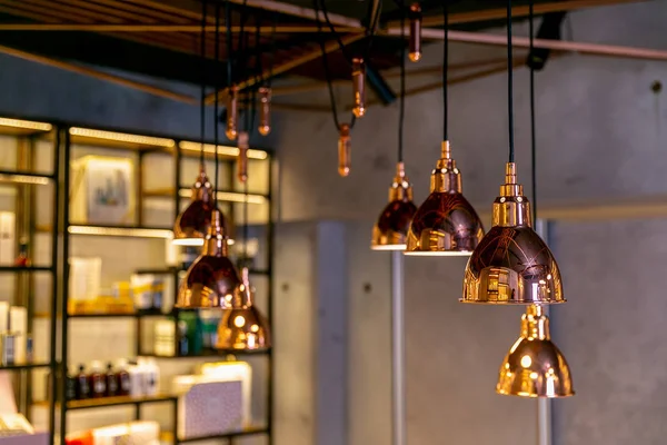 Modern and industrial style lamps in the interior of a beauty salon or restaurant. Loft-style designe interior