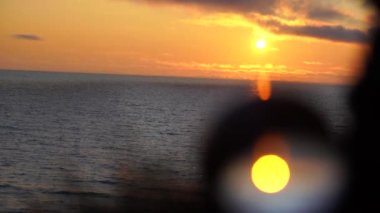 Letonya 'da yaz mevsiminde günbatımında Lensball