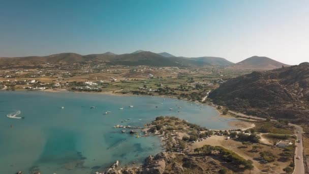 Aerial drone video of sandy beach blue sea water, clear blue sky Paros island Cícladas, Grecia — Vídeos de Stock