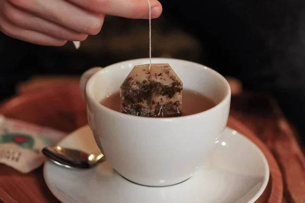 brewing morning express tea in a white cup