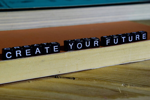 Create your future on wooden blocks. Motivation and inspiration concept. Cross processed image