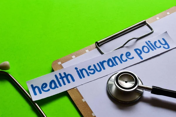 Health insurance policy on healthcare concept inspiration with green background