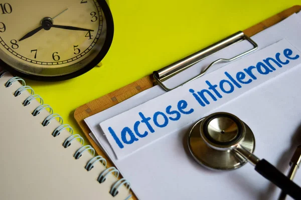 Lactose intolerance on healthcare concept on yellow background