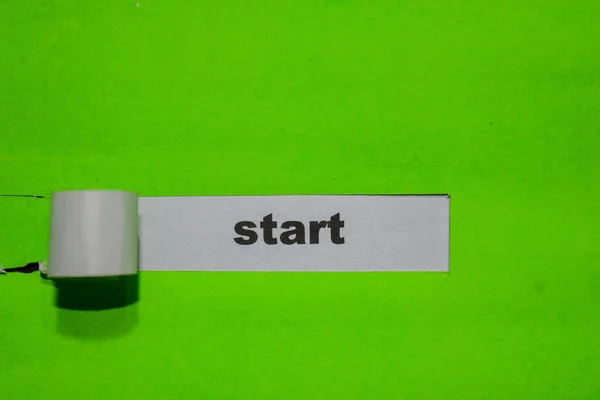 Start, Inspiration and business concept on green torn paper