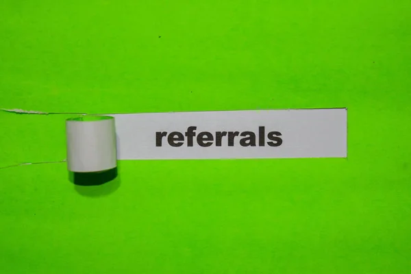 Referrals, Inspiration and business concept on green torn paper