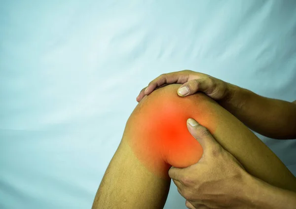 suffering from joint pain with red spot. Hands on leg as hurt from Arthritis. Osteoarthritis knee disease concept