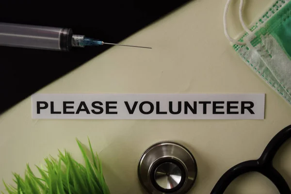 Please Volunteer with inspiration and healthcare/medical concept on desk background