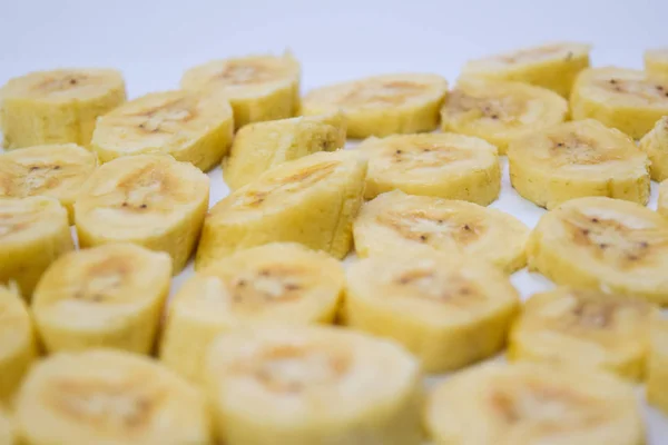 Close up slice yellow banana isolated on white background