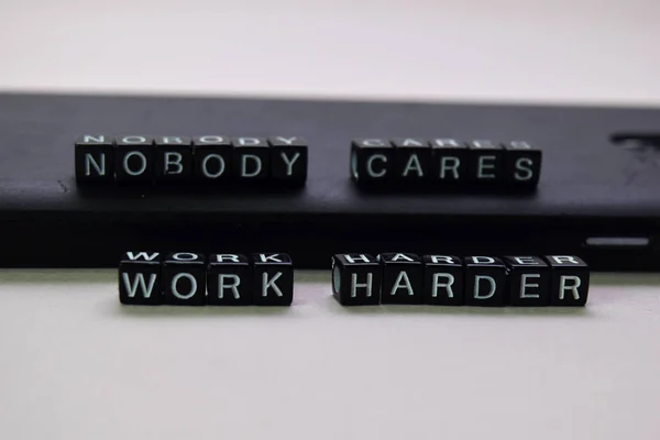 Nobody cares. Work harder on wooden blocks. Motivation and inspiration concept — Stock Photo, Image