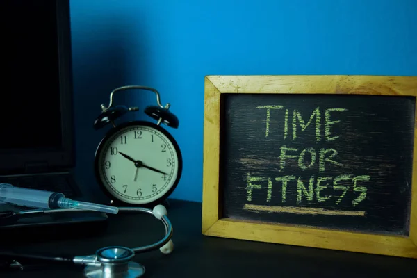 Time For Fitness Planning on Background of Working Table with Office Supplies. Medical and Healthcare Concept Planning on Blue Background