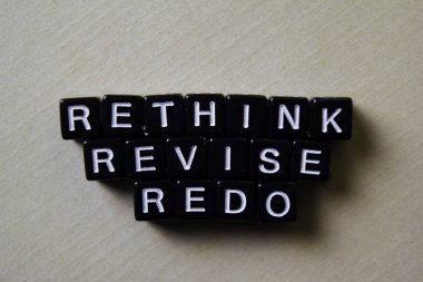 Reflect - Rethink - Redo on wooden blocks. Business and inspiration concept clipart