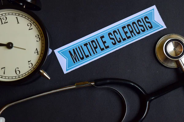 Multiple Sclerosis on the print paper with Healthcare Concept Inspiration. alarm clock, Black stethoscope. — Stock Photo, Image