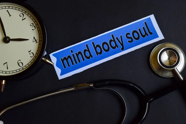 Mind Body Soul on the print paper with Healthcare Concept Inspiration. alarm clock, Black stethoscope.