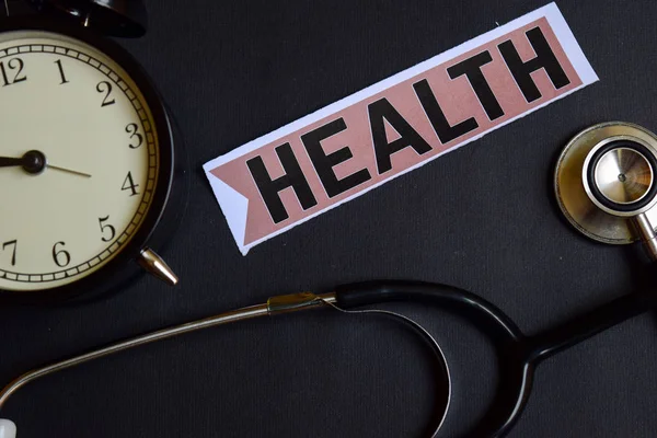 Health on the paper with Healthcare Concept Inspiration. alarm clock, Black stethoscope. — Stock Photo, Image