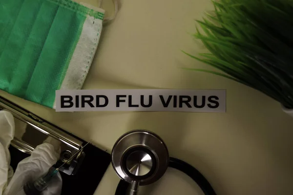 Bird Flu Virus with inspiration and healthcare/medical concept on desk background
