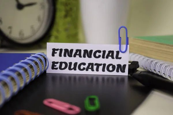 Financial Education on the paper isolated on it desk. Business and inspiration concept