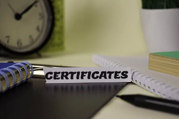 Certificates on the paper isolated on it desk. Business and inspiration concept