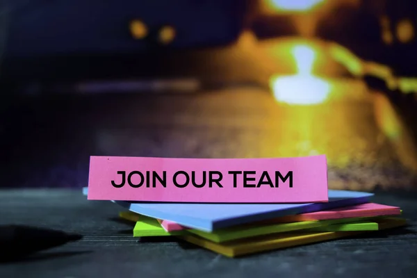 Join Our Team on the sticky notes with bokeh background