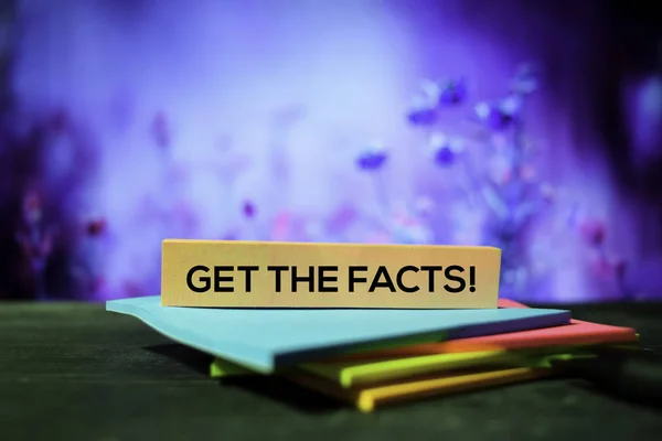 Get The Facts! on the sticky notes with bokeh background