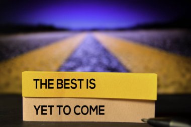 The Best Is Yet To Come on the sticky notes with bokeh background clipart