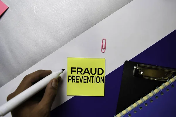 Fraud Prevention text on sticky notes with color office desk concept