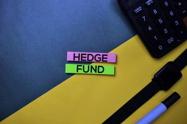 Hedge Fund text on top view color table background.