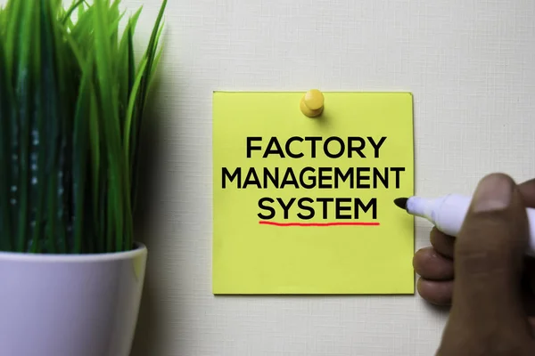 Factory Management System text on sticky notes isolated on office desk