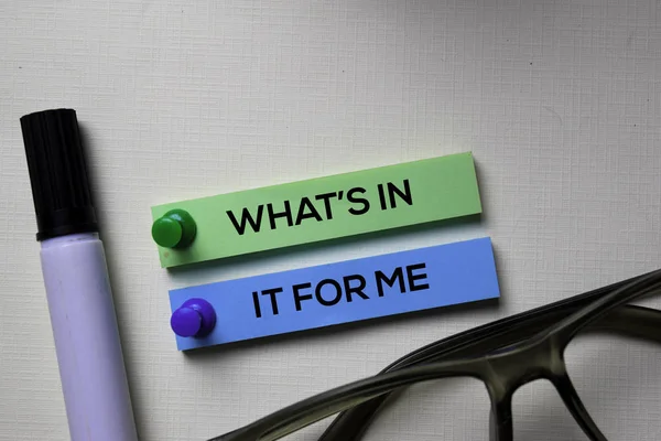 What's In It For Me text on sticky notes isolated on office desk