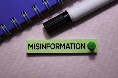 Misinformation text on sticky notes isolated on office desk clipart