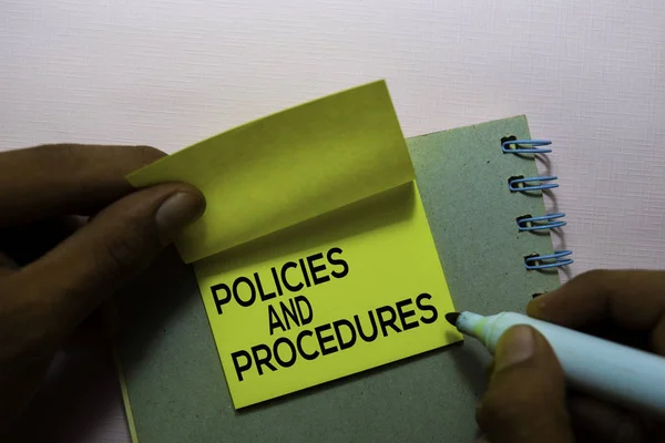 Policies and Procedures text on sticky notes isolated on office desk — Stock Photo, Image