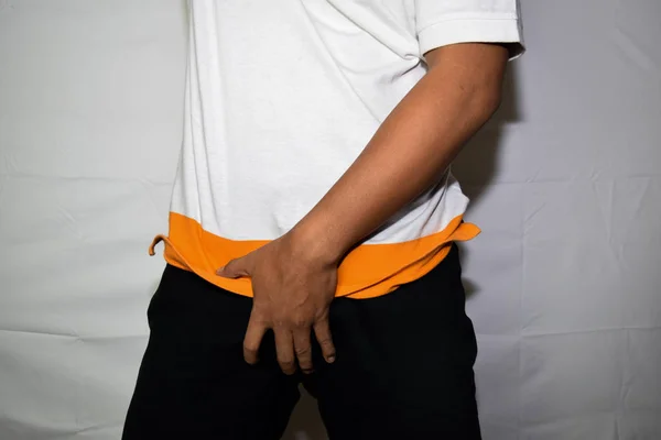 Close up Asian man covering his crotch isolated on white background — Stock Image Close up Asian man covering his crotch isolated on white background Royalty Free Stock Images