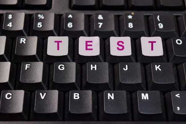 Test write on keyboard isolated on laptop background