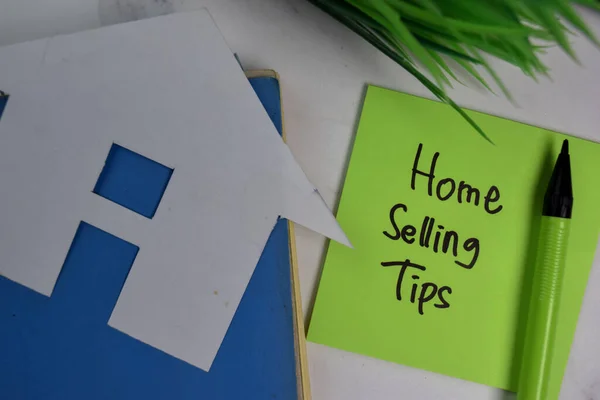 Home Selling Tips write on sticky notes isolated on office desk.