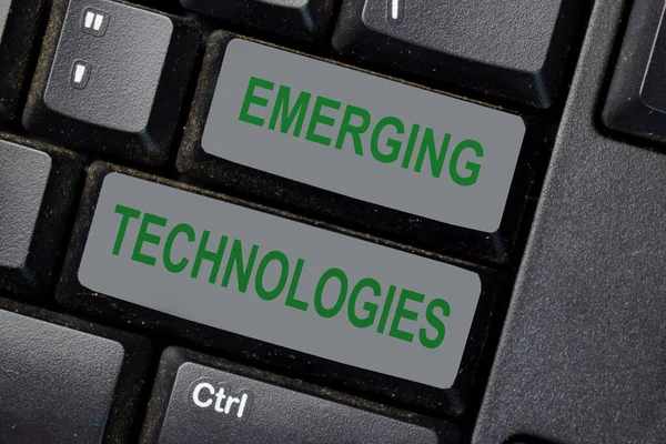 Emerging Technologies text write on keyboard isolated on laptop background