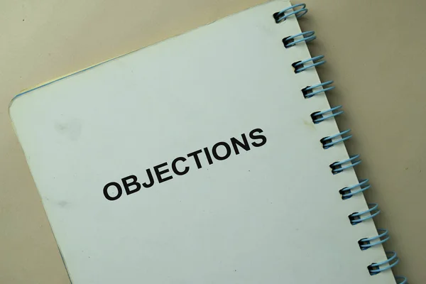 Objections write on a book isolated on office desk.