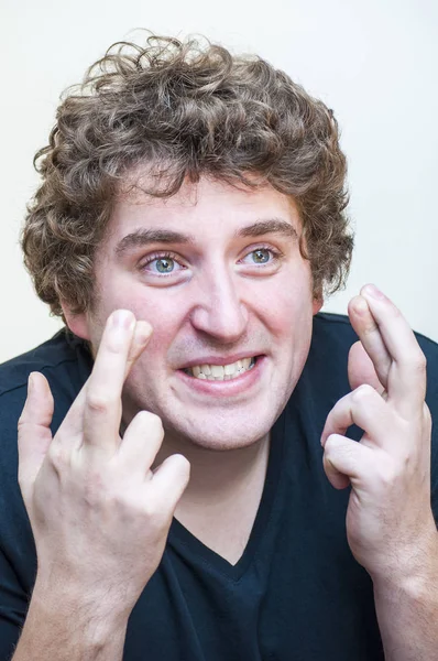 Portrait Young Funny Venturesome Curly Man Holding Crossed Fingers Hope — Stock Photo, Image