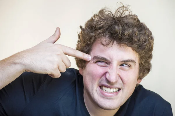 Portrait Young Stressed Paranoid Curly Man Finger Gun His Temple — Stock Photo, Image